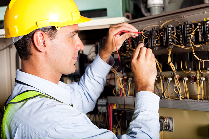Electrical maintenance. Electrician busy with a maintenance work. Building services.